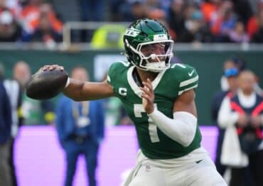 Justin Fields goes to throw the ball.