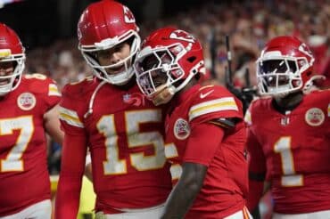 Patrick Mahomes rests on shoulder.
