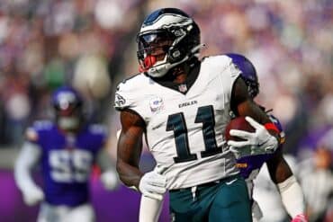 A.J. Brown holds the ball and runs.