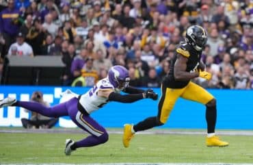 DK Metcalf runs the ball.
