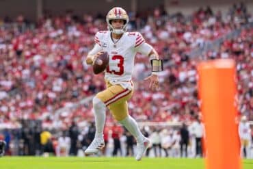 San Francisco 49ers quarterback Brock Purdy runs the ball.