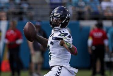 Jaxson Smith runs the ball.