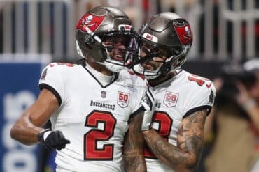 Emeka Eubka and Mike Evans celebrate.