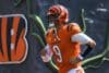 Joe Burrow runs out of the tunnel.