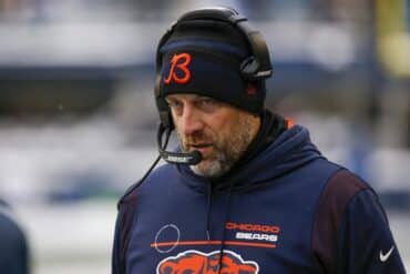Chicago Bears head coach Matt Nagy stands up.