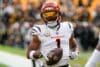 Ja'Marr Chase runs with a ball.