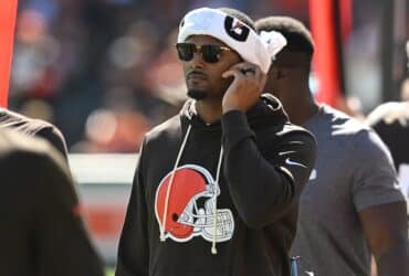 Deshaun Watson standing on the phone.