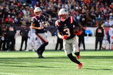 New England Patriots wide receiver Demario Douglas runs the ball.