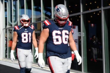 Patriots offensive tackle Will Campbell walks out.