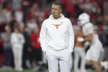 Steve Sarkisian walks on the field.