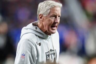 Las Vegas Raiders head coach Pete Carroll stands.