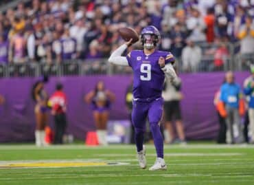 J.J. McCarthy readies to throw the ball.