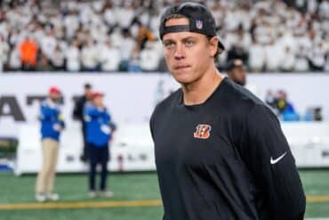 Joe Burrow walks on the field.