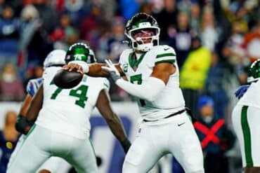 Justin Fields readies to throw a ball.
