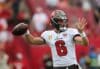 Baker Mayfield goes back to pass.