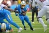 Chargers running back Omarion Hampton runs the ball.