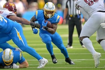 Chargers running back Omarion Hampton runs the ball.