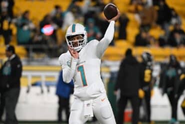 Dolphins quarterback Tua Tagovailoa throws the ball.