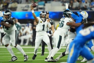Eagles quarterback Jalen Hurts throws the ball.