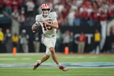 Hoosiers quarterback Fernando Mendoza holds the ball.