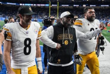 Mike Tomlin celebrates off the field.
