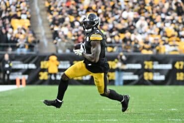DK Metcalf runs with the ball.