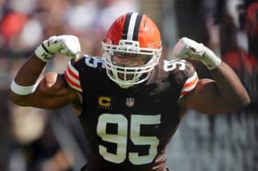 defensive end Myles Garrett flexes.