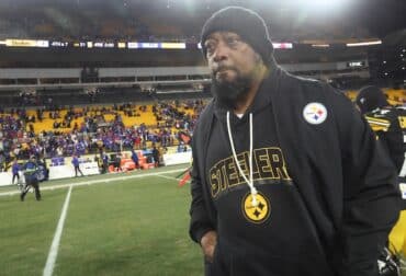 Mike Tomlin walks off the field.