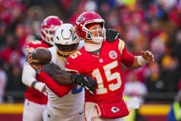 Quarterback Patrick Mahomes goes to throw the ball.