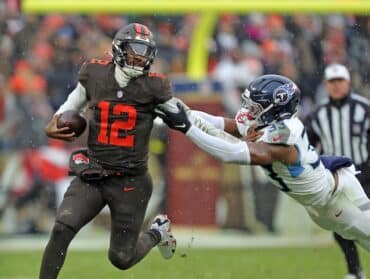 Quarterback Shedeur Sanders runs the ball.