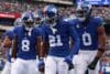 New York Giants cornerback Paulson Adebo stands in the end zone.