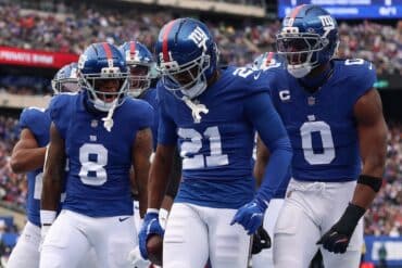New York Giants cornerback Paulson Adebo stands in the end zone.