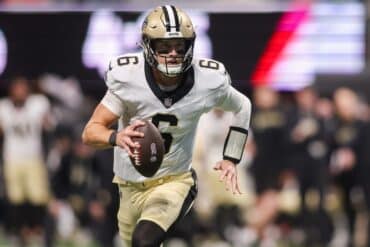 Saints quarterback Tyler Shough runs with the ball.