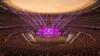 Packed World Cup stadium during opening ceremony with dramatic stage lighting and thousands of fans