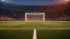 Dramatic view of soccer penalty spot and goal in packed stadium with atmospheric lighting