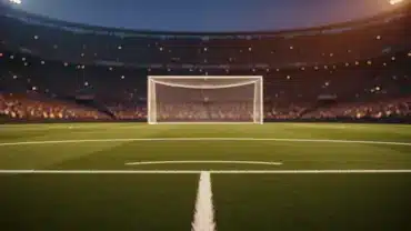 Dramatic view of soccer penalty spot and goal in packed stadium with atmospheric lighting