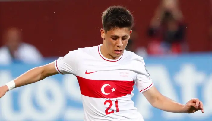 Arda Güler wearing Turkey national team jersey during a match.