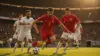 Belgian soccer players attacking against Iran in World Cup match at stadium