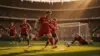 Belgium vs Iran World Cup match action with striker attacking goal in packed stadium