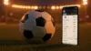 Soccer ball and betting smartphone on stadium grass with floodlights at dusk