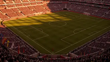 Aerial view of World Cup soccer stadium with pristine pitch and crowd during golden hour