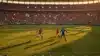 World Cup soccer match in packed stadium with players in action during golden hour lighting