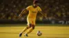 Brazilian soccer player in yellow jersey dribbling ball during World Cup match at stadium