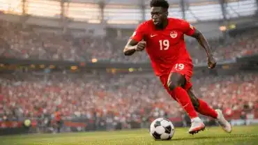 Alphonso Davies sprinting with ball for Canada at BC Place Stadium during 2026 World Cup
