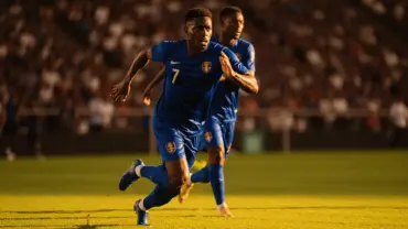Cape Verde soccer players in blue jerseys during World Cup 2026 match action against Saudi Arabia