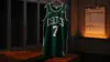 Boston Celtics jersey in locker room with financial documents suggesting salary cap trade decision