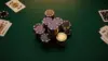 Luxury poker table with premium chips and cards under dramatic lighting