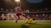 Croatian soccer player shoots toward goal during intense World Cup match at stadium