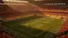 World Cup stadium with vibrant team supporters during golden hour match day