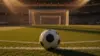 Soccer ball on stadium grass with goal and stands in background during golden hour
